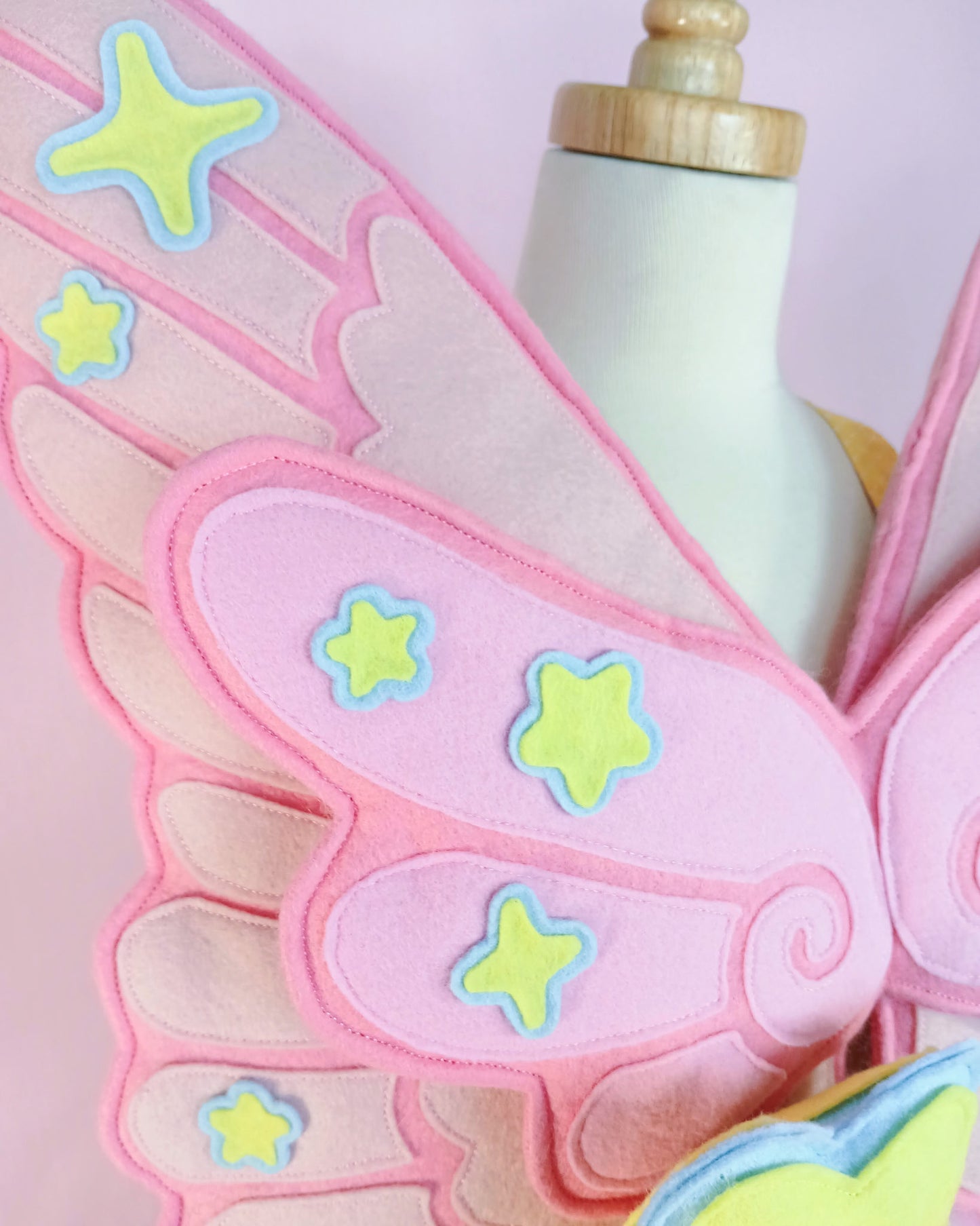 Luxury handcrafted with premium wool felt Pegasus wings for kids dress-up, featuring hidden charm pockets and snap-on wand charms, handmade in USA