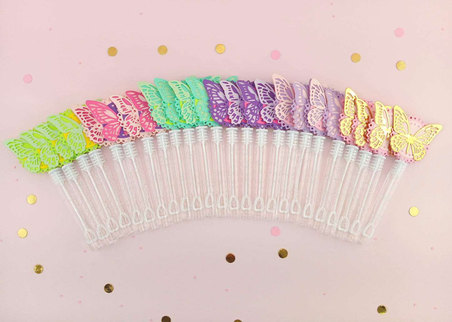 Colorful rainbow assortment of 30 butterfly bubble wands arranged in a fan shape on a pink confetti background, perfect for party supplies or classroom gifts