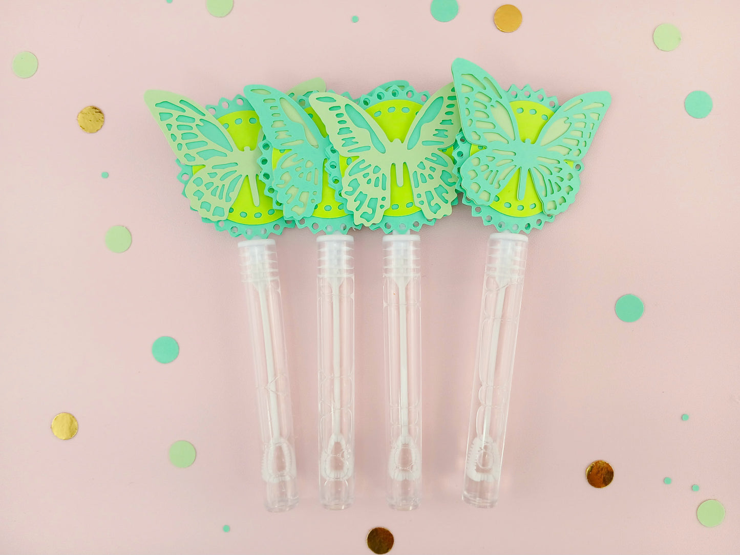 Mint green and lime yellow butterfly bubble wands with double-layered paper toppers, ideal for spring parties or bug-themed birthday celebrations