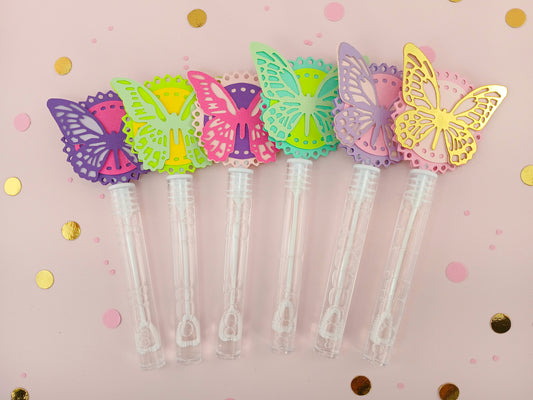 Set of six butterfly party bubble wands in assorted pastel colors with decorative paper toppers, perfect for birthday party favors or spring celebrations