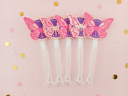 Fuchsia and light pink butterfly party bubble wands with purple accents, perfect for garden-themed birthday parties or whimsical girl party favors